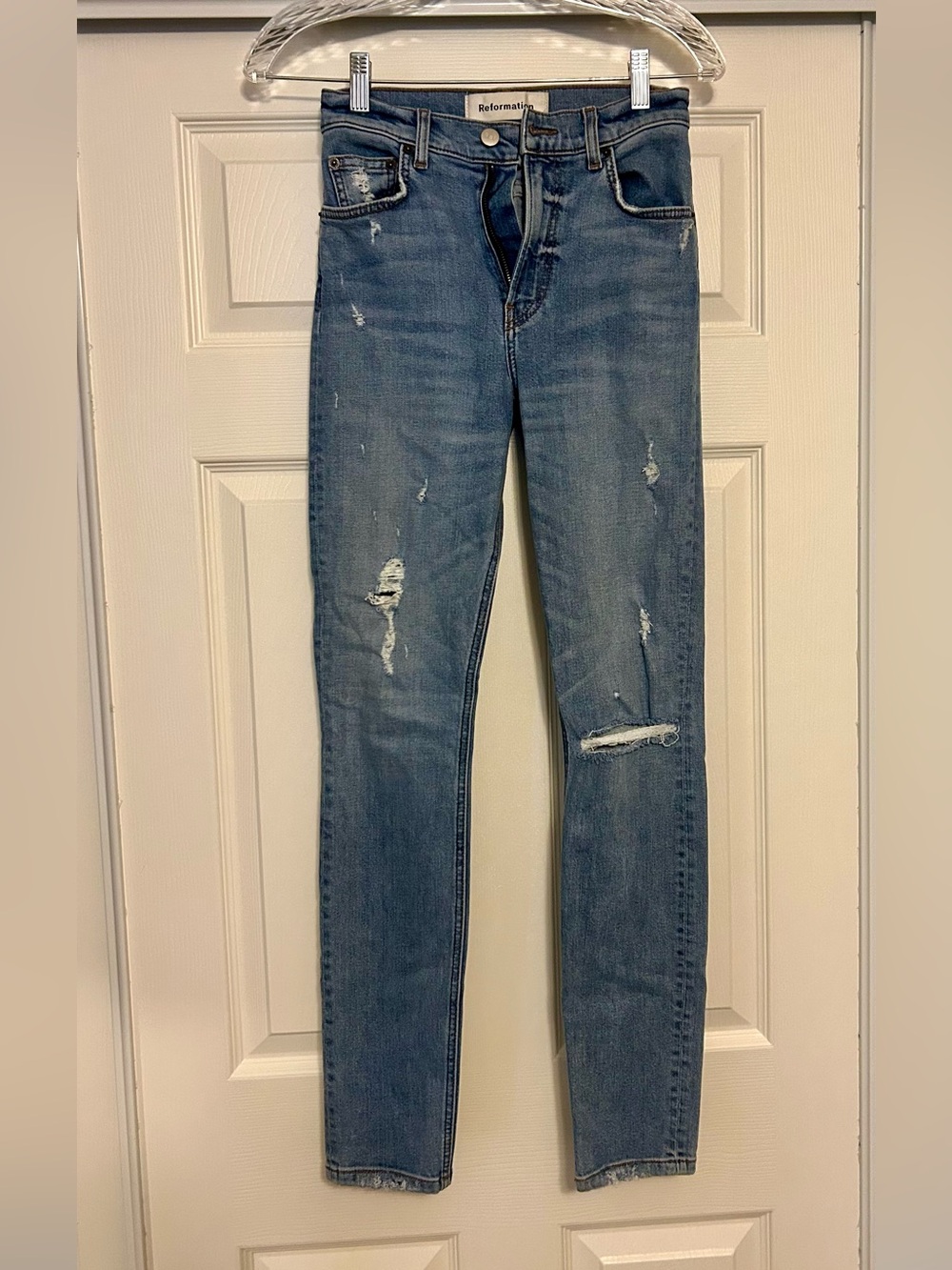 Reformation blue distressed skinny jeans
